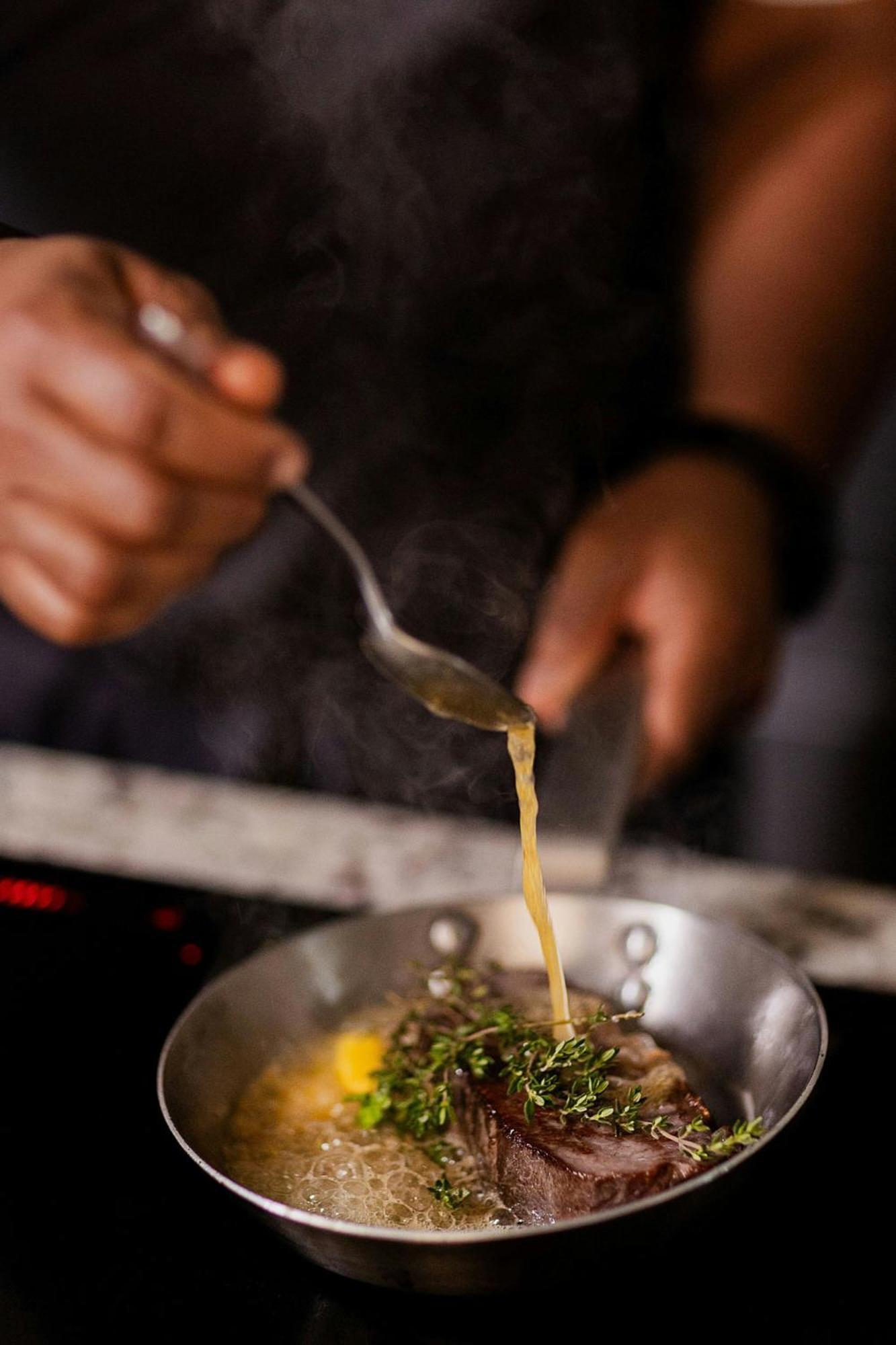Stock Exchange Hotel, Manchester, Autograph Collection Exterior foto A chef seasoning a dish